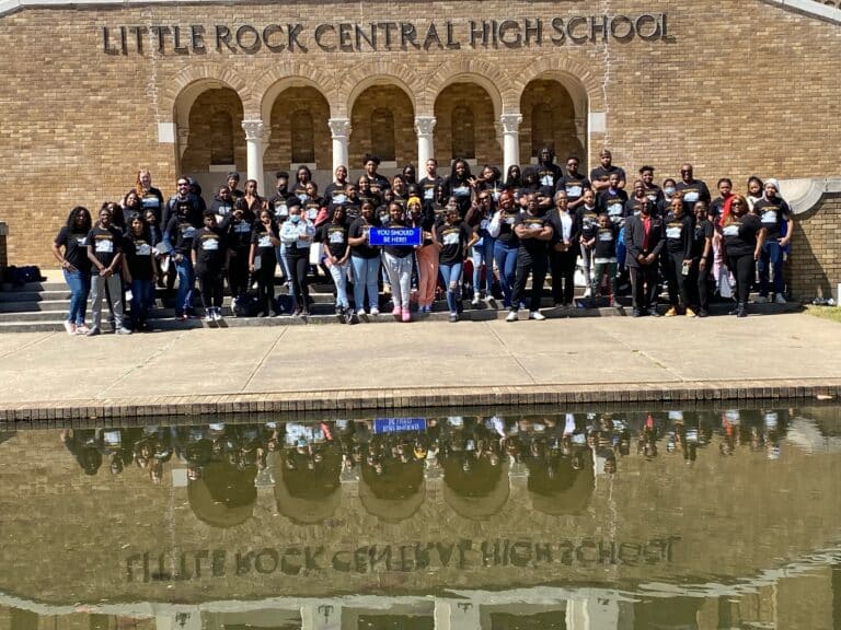 Students pose in front of Central High School in Little Rock, Arkansas