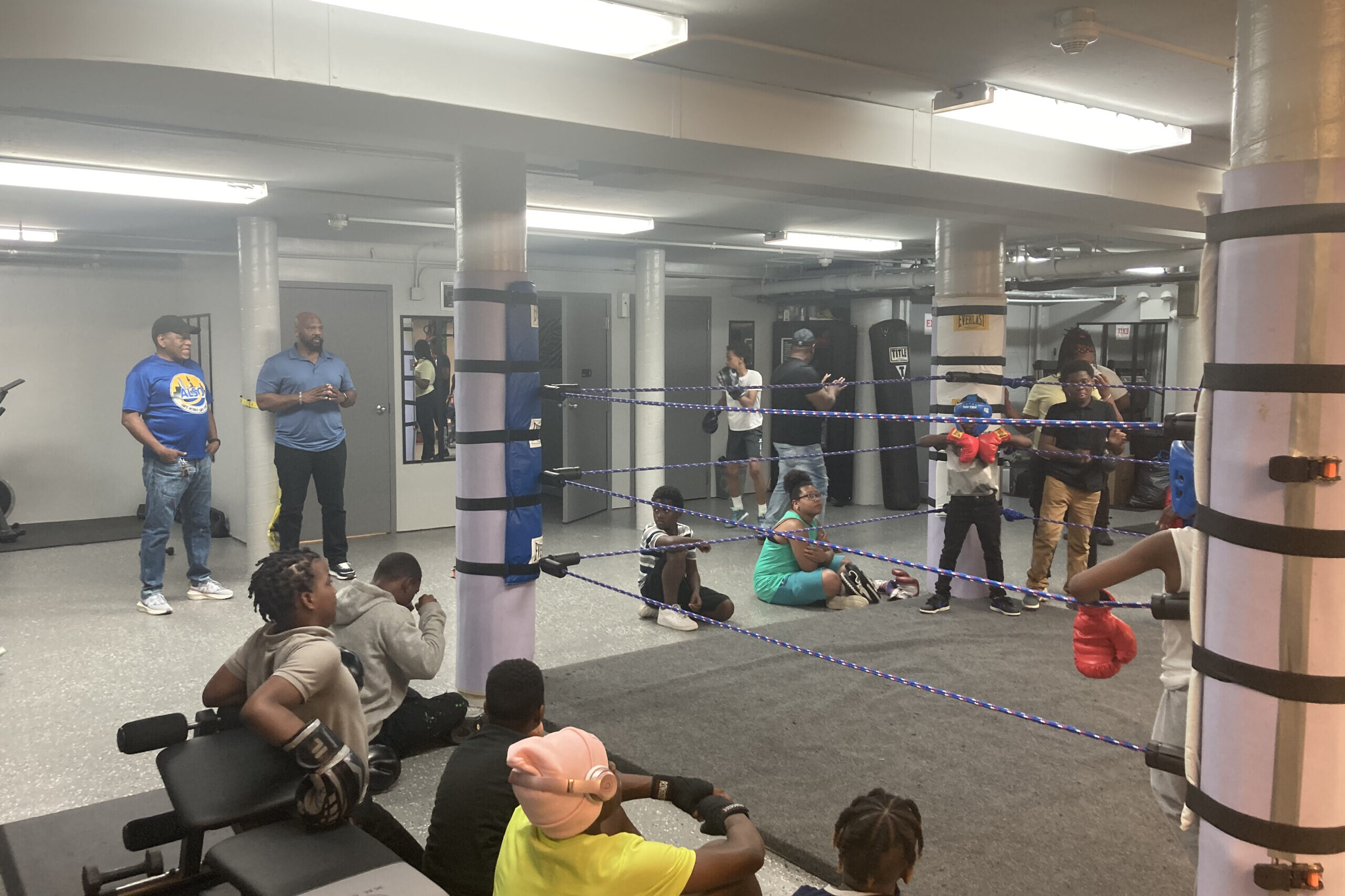 Youth and coaches gathered at the boxing club.