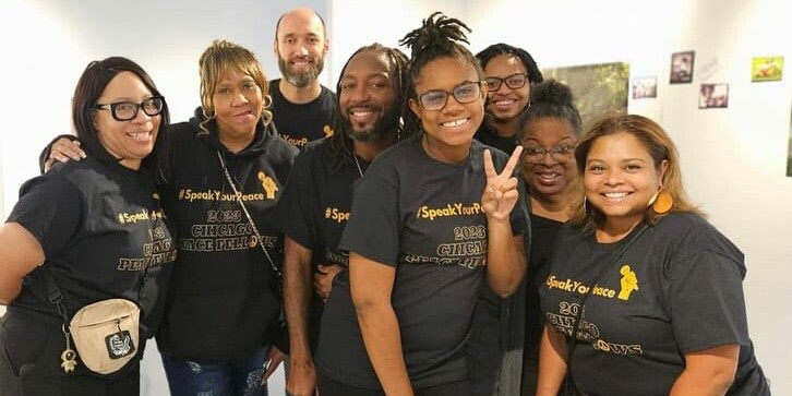 Members of the Speak Your Peace Team posing together at the event