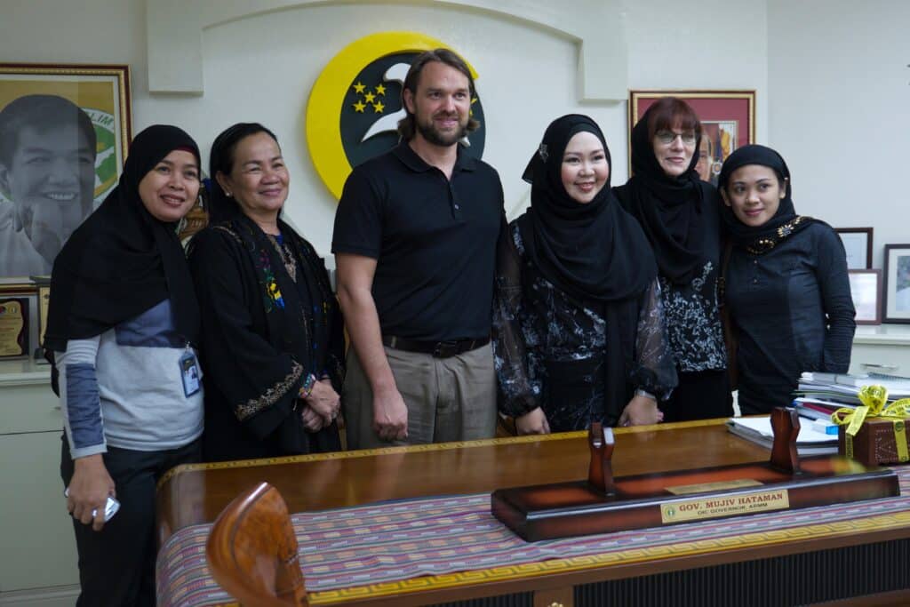 Group Photo at the ARMM Governors Office featuring Susana Anayatin, Travis Rejman and Diane Goldin