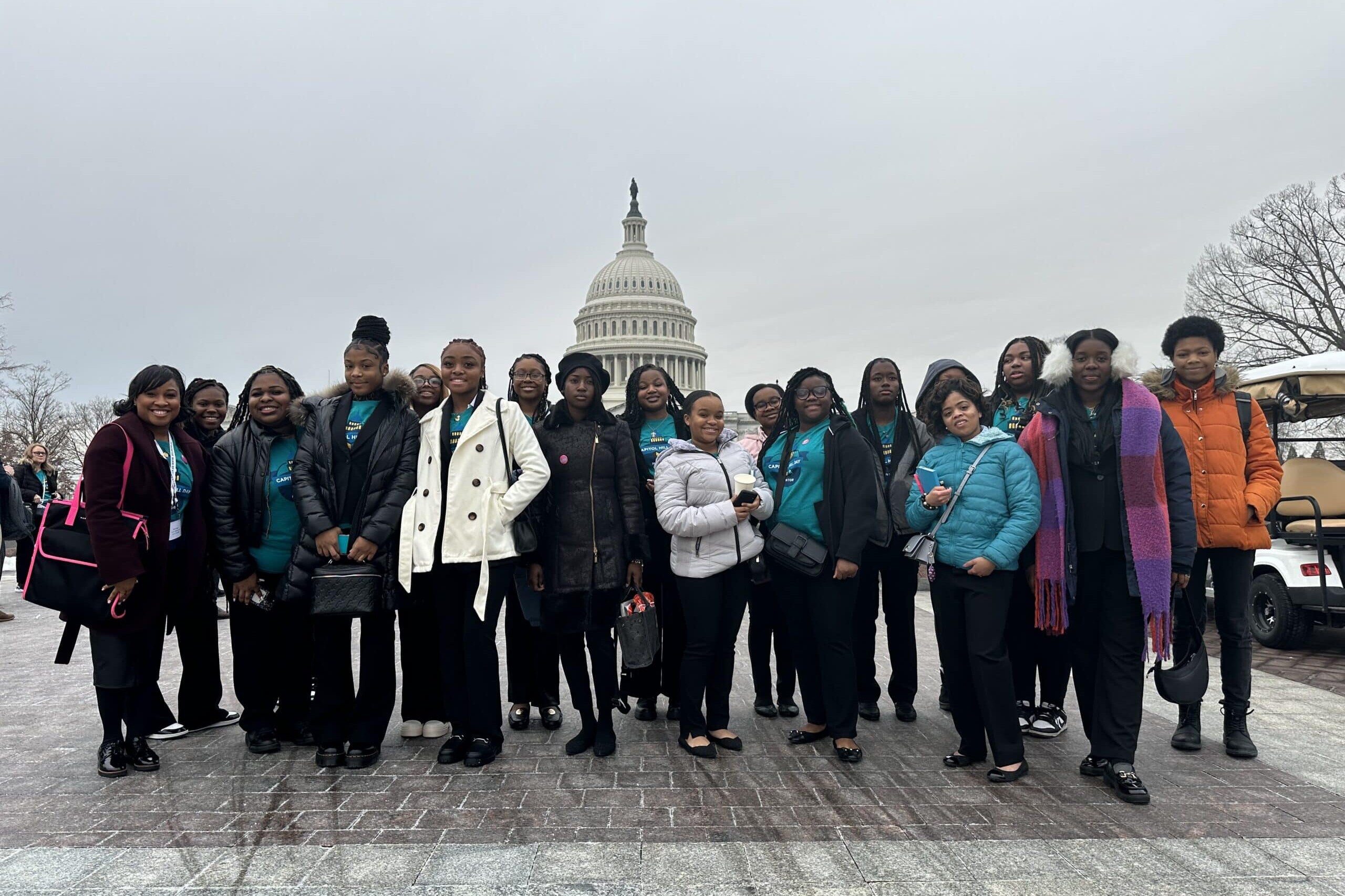 Ladies of Virtue posing in front of the United States Capitol