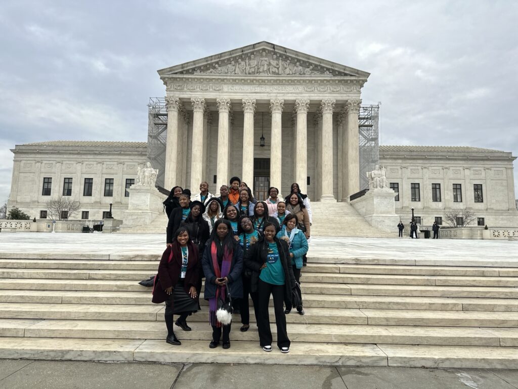 Ladies of Virtue posing in front of the Supreme Court 