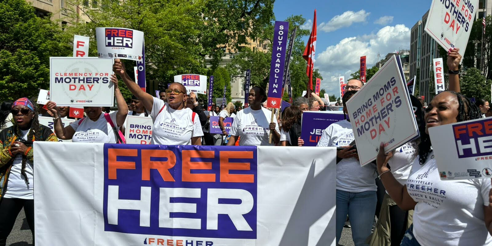 a crowd advocating for clemency at the FreeHer March