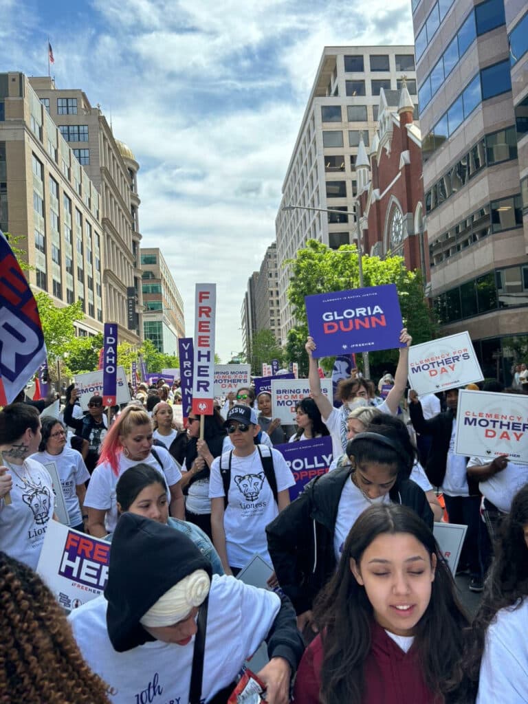 a crowd advocating for clemency at the FreeHer March