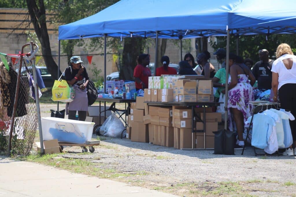 a tent with free resources distributed at the summer cool down.