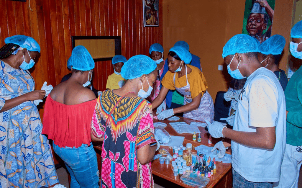 A community of people with sickle cell disease making resin art together