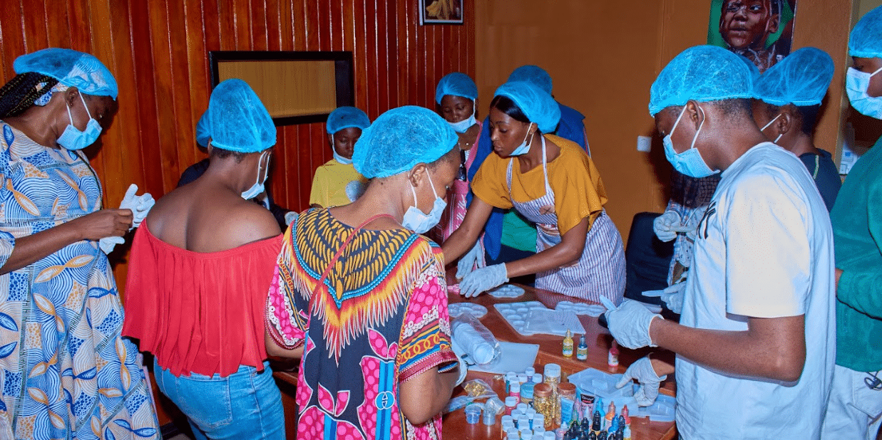 A community of people with sickle cell disease making resin art together