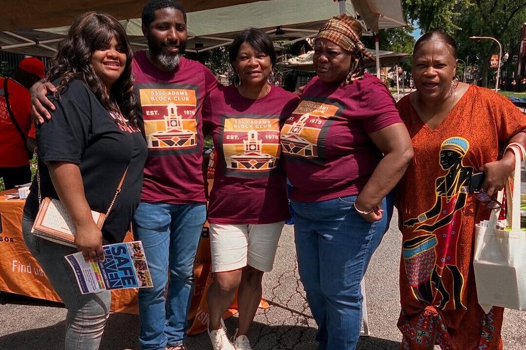 A group of block club volunteers posing at the block party