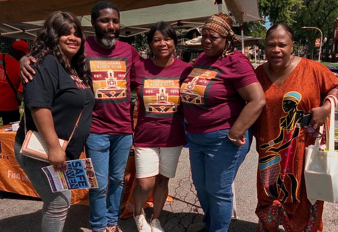 A group of block club volunteers posing at the block party