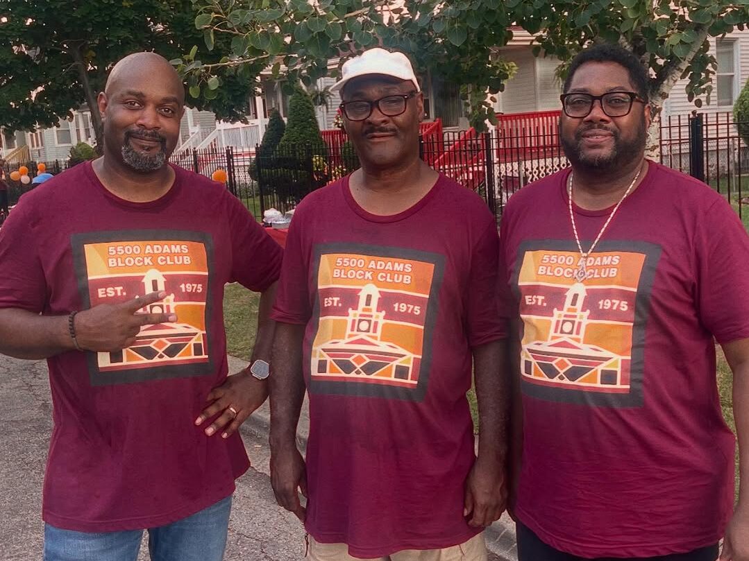 Tony Daniels and two block club volunteers posing at the block party