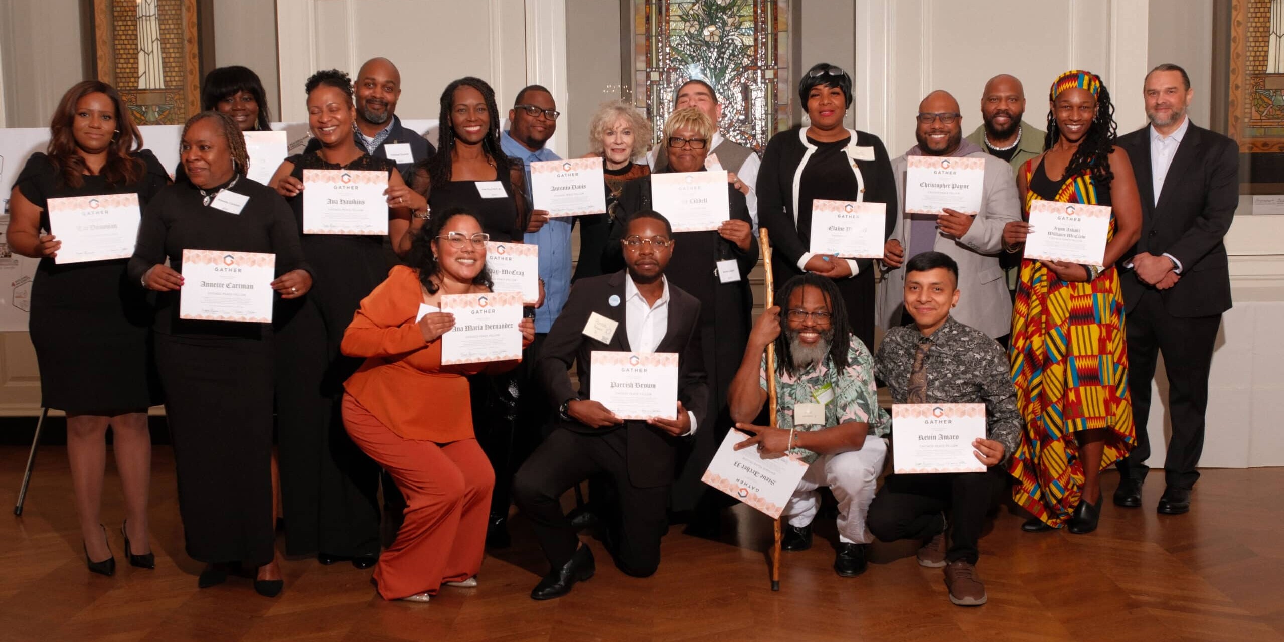 The 2024 Chicago Peace Fellows holding their graduation certificates