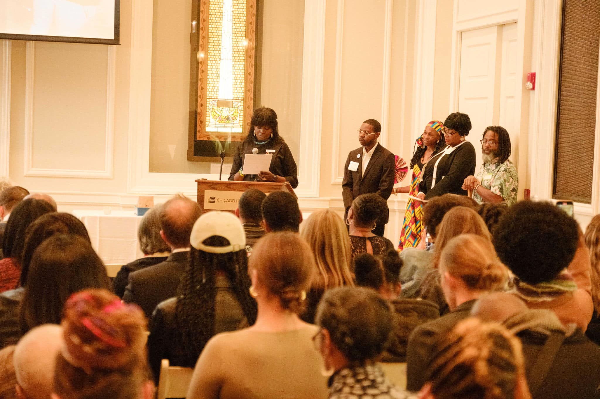 The "Growth" group of Chicago Peace Fellows presenting in front of an audience