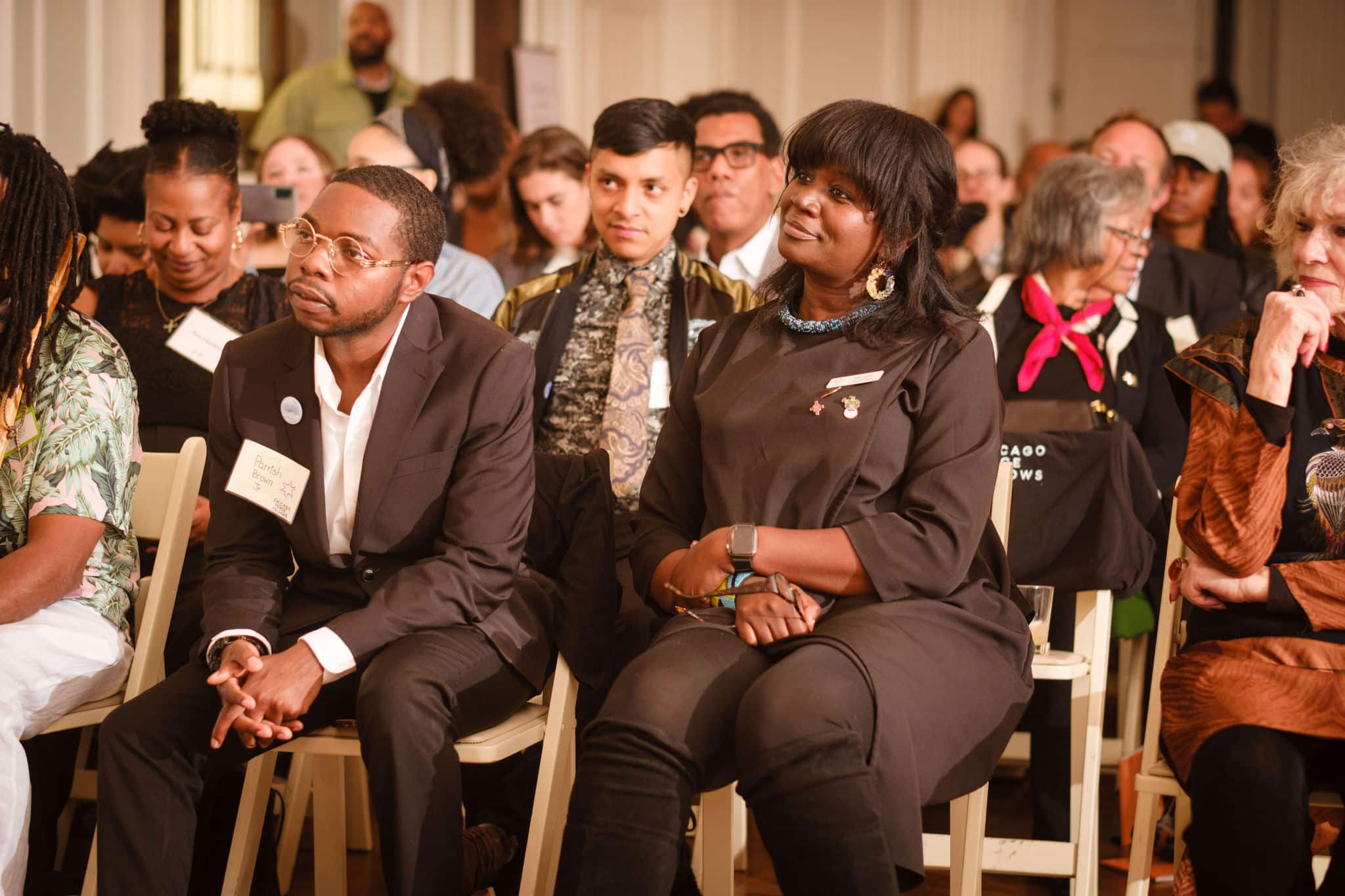 The audience of the Chicagi Peace Fellows graduation with members of the Peace Fellows class sitting at the front